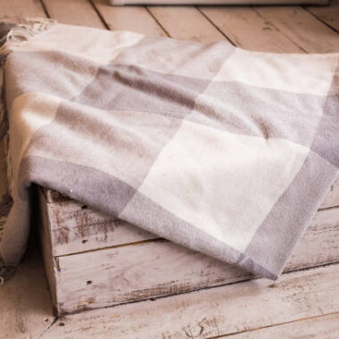 Still life details, wool white plaid. lazy winter weekend. cozy interior.
