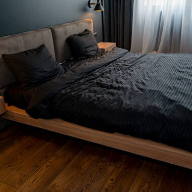 A large bed sitting in a room. high quality photo